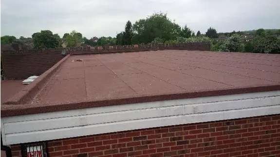 Red felt flat roof on a large building